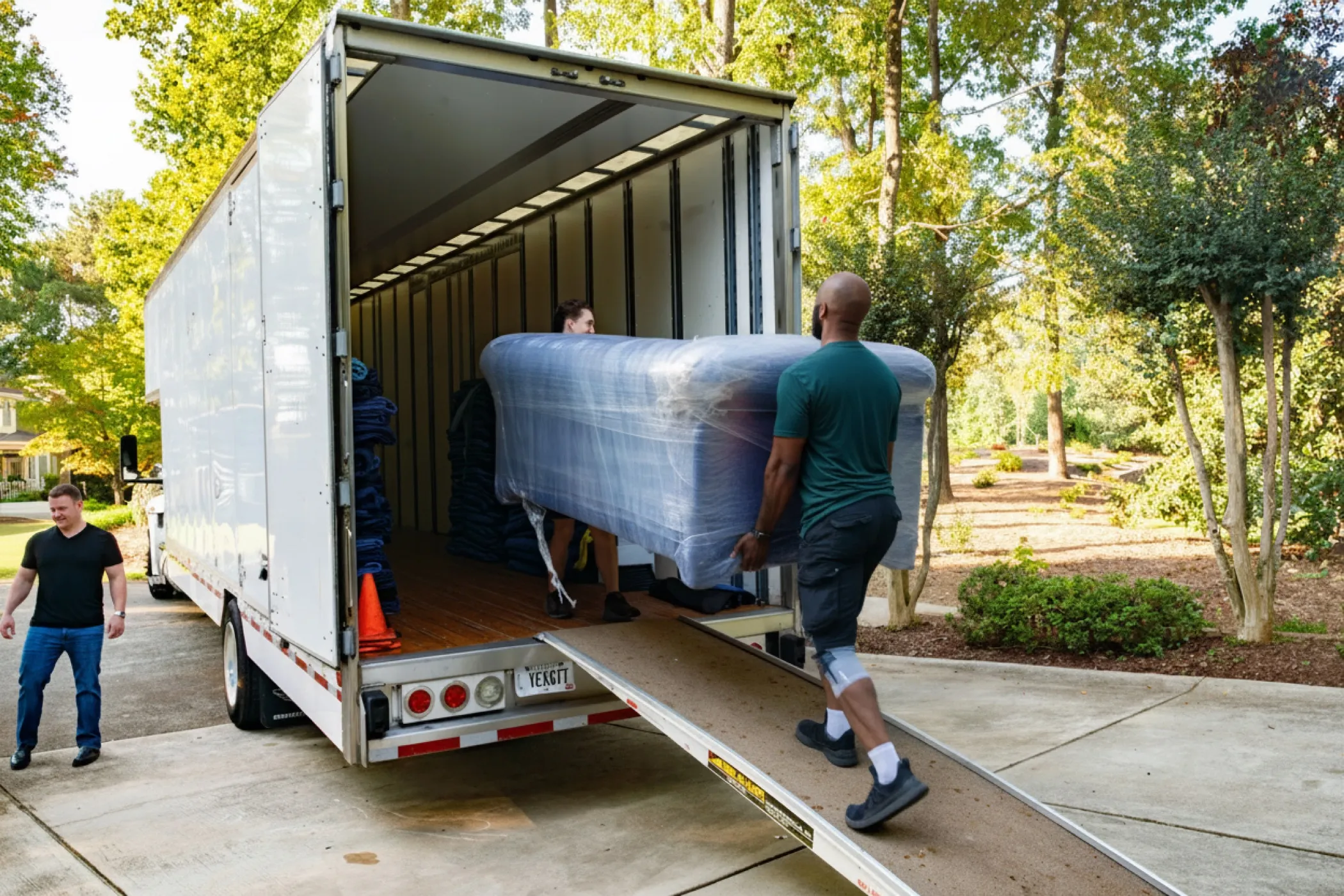 A home service professional loading a moving truck